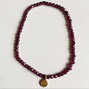 Satya stretch bracelet, like new. Garnet, lotus